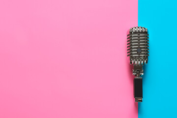 Wall Mural - Retro microphone on color background