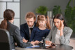© Pixel-Shot - Young couple and their daughter visiting divorce lawyer in office