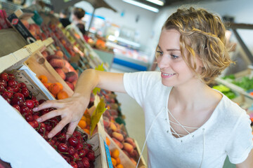 customer checking the cherries from the box