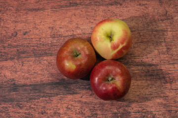 Three fresh apples on the table