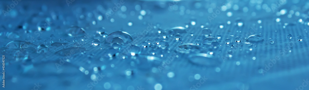 Clear water drops on a blue background. Close-up - obrazy, fototapety, plakaty 