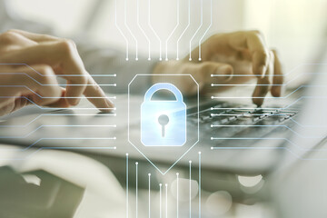 Aufkleber - Double exposure of creative lock hologram with chip and hands typing on laptop on background. Information security concept