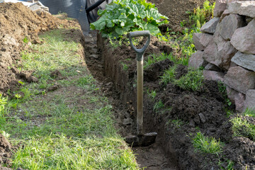 Digging ground to make drainage home.