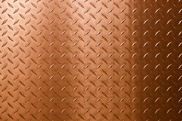 Wall Mural - Abstract background of copper texture with a diamond pattern.