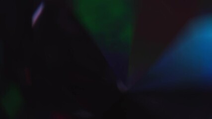 Wall Mural - Rainbow neon multicolored light through crystal glass prism. Abstract background