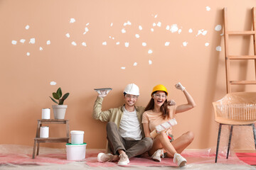 Canvas Print - Happy young couple resting during repair in their new house