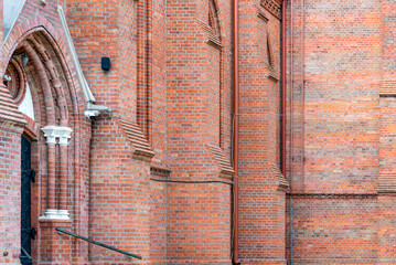 Fragment red brick wall catholic church background.