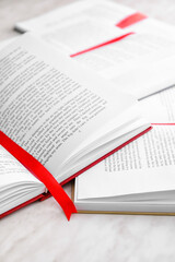 Poster - Open books with bookmarks on light background, closeup