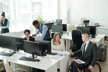 Aufkleber - Two small groups of intercultural office managers working in teams