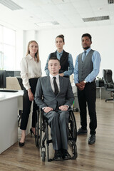 Canvas Print - Group of intercultural business people standing in large open space office