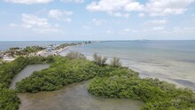 Aerial Of A Secluded Mangrove Bay With Sunshine Skyway Bridge In The Distinct Background