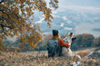 © SHOTPRIME STUDIO - woman hiker next to dog friendship nature mountains travel