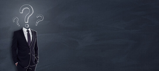 Poster - Creative idea and business brainstorming concept with man in black and question mark on his shoulders on blank blackboard background. Mockup