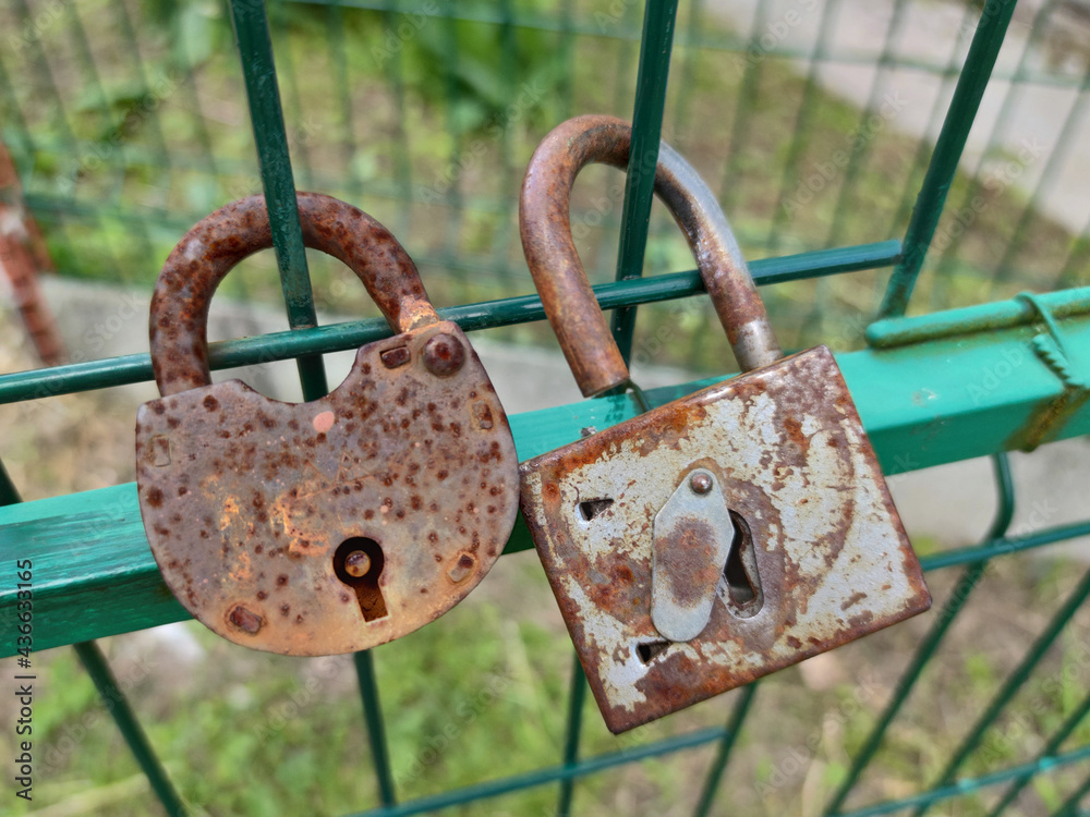 Rusty Pick Lock Old rust lock on the set. Metal lock on the gate in the village. Two ...