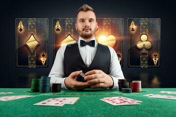 Male dealer at the casino at the table. Casino concept, gambling, poker, chips on the green casino table.