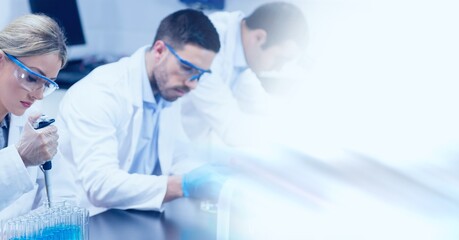 Poster - Composition of male and female lab technicians at work, with blurred copy space to right