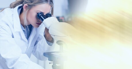 Poster - Composition of female lab technician using microscope, with blurred copy space to right