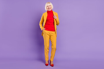 Canvas Print - Full body photo of cheerful nice short hairdo aged lady wear yellow suit isolated on purple color background