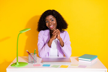 Poster - Photo of young happy cheerful african businesswoman sit table having job interview isolated on yellow color background