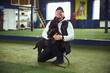 © Svitlana - Happy instructor and his affectionate canine friend