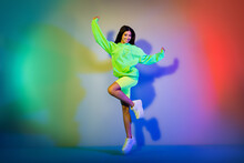 Full Length Body Size View Of Attractive Cheerful Girl Jumping Having Fun Isolated Over Multicolor Vivid Neon Light Background