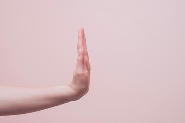 Wall Mural - hand of a person showing stop gesture