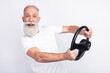 © deagreez - Photo of happy cheerful positive old man hold steering wheel smile rider isolated on grey color background