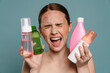 © Drobot Dean - Ginger shirtless woman with pimples screaming while showing cosmetics