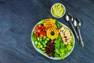 Wall Mural - Healthy colorful salad with vegetable and chicken breast.