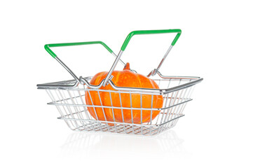 Ripe pumpkin in shop basket isolated on white background