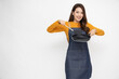 © comzeal - Young Asian woman housewife wearing kitchen apron cooking and holding pan and spatula isolated on white background