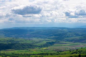 Wall Mural - landscape with hills on a cloudy day