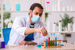 © Elnur - Young male chemist testing soap in the lab
