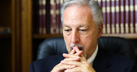 Canvas Print - Portrait of a thoughtful manager in his office