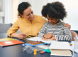 © Peakstock - Professional female psychologist works with African American little girl. Positive child during a psychotherapy session