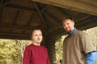 © Людмила Полякова - young man and a girl are standing under the roof