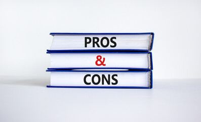 Pros and cons symbol. Books with words 'Pros and cons'. Beautiful white background. Business, pros and cons concept, copy space.