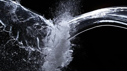 Wall Mural - super slow motion shot of water splashes crashing on black background at 1000fps.