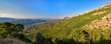 Fototapeta Na sufit - Panoramic Mountain Landscape with layered by blue sky over the mountain ranges, Sardinia, Orosei region.