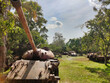 Old soviet tanks from cambodian war T-54 T-55. Tropical vegetation in Siem Reap War Museum. Cambodia. South-East Asia