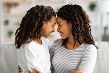 Wall Mural - Closeup of loving african american family mother and daughter