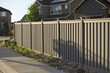 Shot of the fence around the house in the neighborhood during the sunset.
