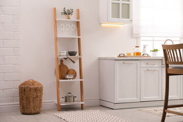 Sticker - Stylish kitchen room interior with wooden ladder near white wall