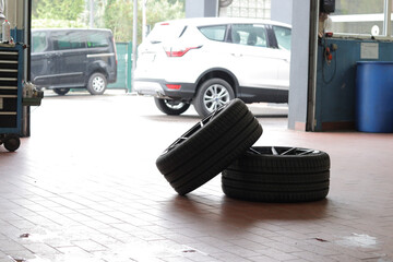 Workshop with two car tires on the floor during a repairing