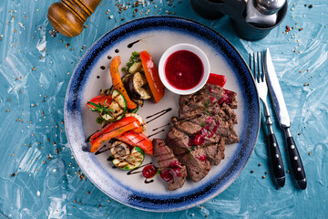 Wall Mural - Delicious juicy beef steak with grill vegetables.