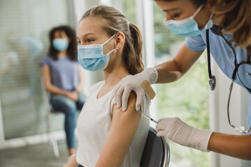 Teenager Girl Getting Vaccinated Due To Covid-19