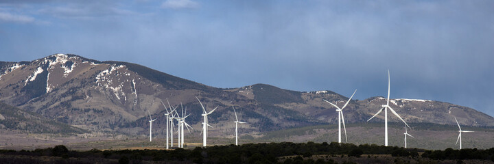 Wall Mural - Wind farm against a scenic background of mountains in Utah