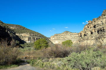 Canvas Print - Plateau Creek flows along the scenic byway past sheer cliffs on Grand Mesa in Colorado