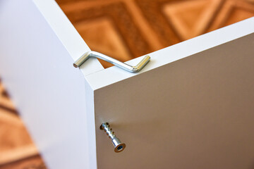 Assembly of cabinet furniture. screwdriver, screws, furniture fittings, door hinges. self-assembly of furniture