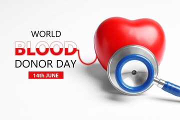Wall Mural - World Blood Donor Day. Stethoscope and heart model on white background, closeup